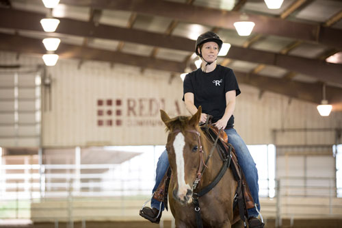 Woman riding horse