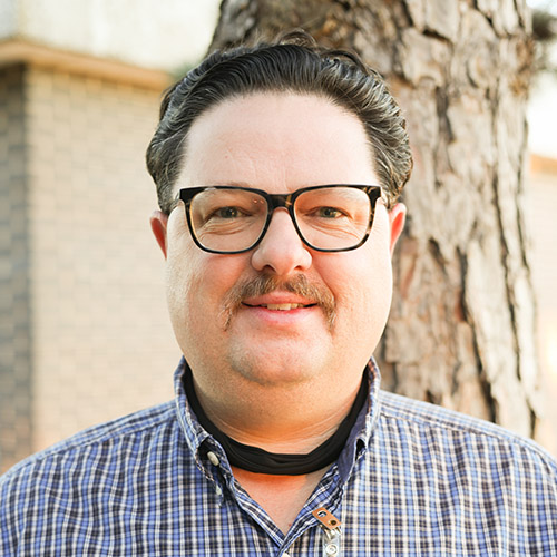 Man with a moustache and glasses