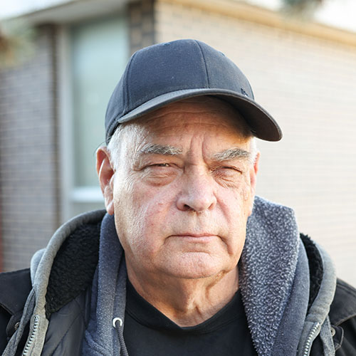 Man wearing a dark ballcap