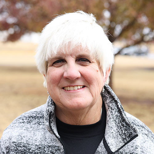 Woman with short white hair